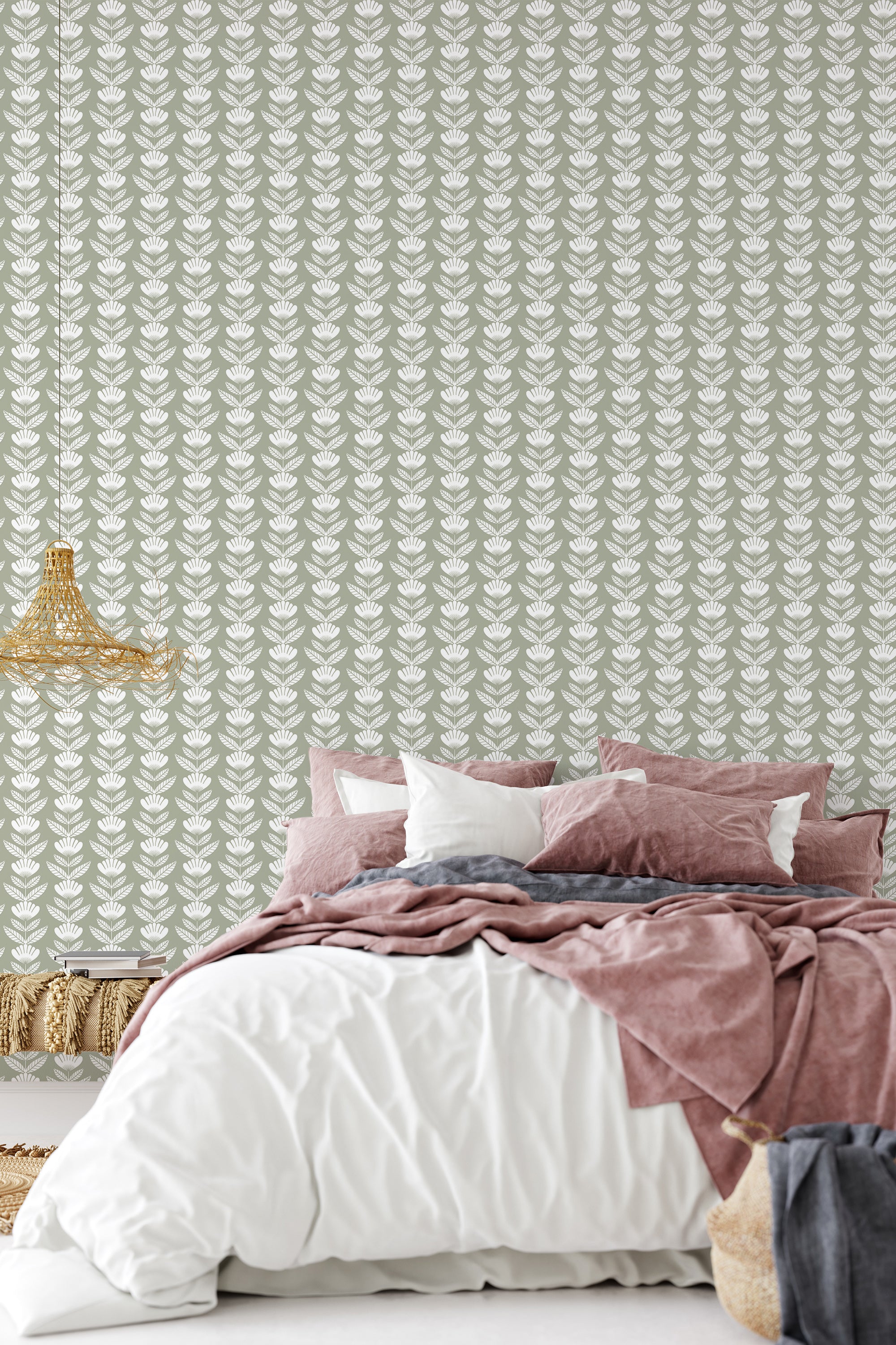 A bedroom with a wall covered in Lined Flower patterned wallpaper with rows of stylized floral motifs in soft tones, behind a bed dressed in pink and white bedding, traditional wallpaper.