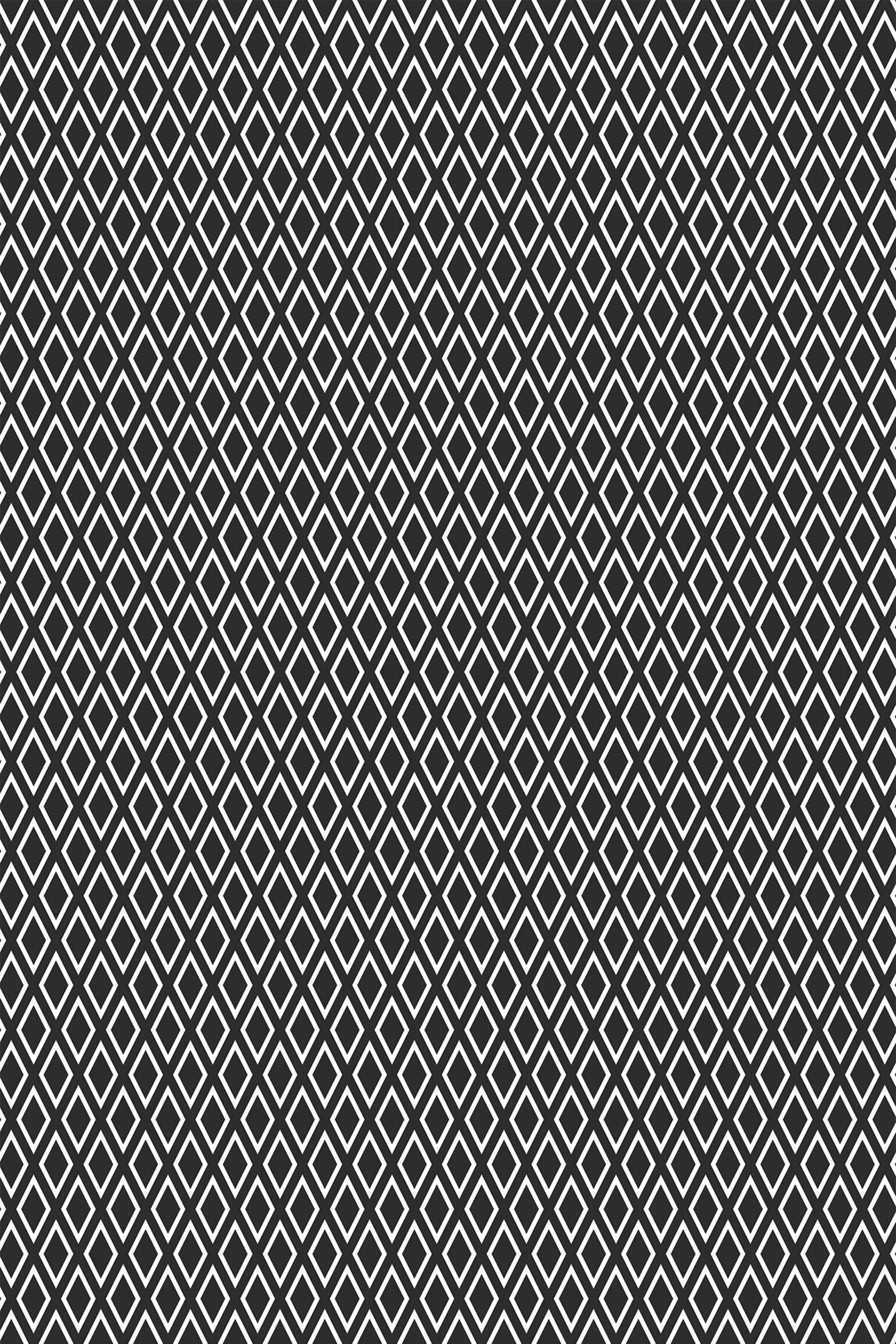 A black and white Harlequin wallpaper pattern with a geometric design of interlocking diamond shapes. Peel and stick removable wallpaper.