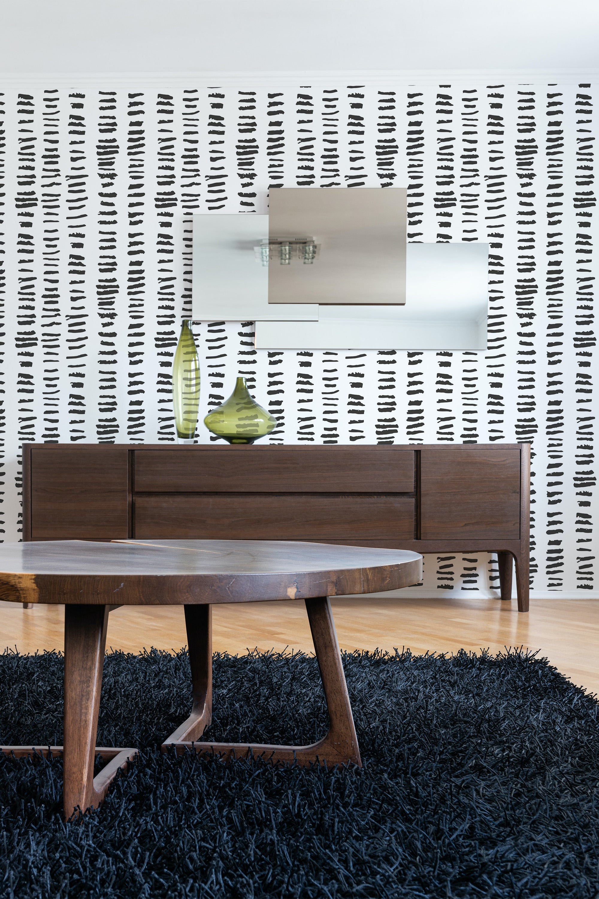 The wallpaper design contains irregular, short black brush strokes arranged in a vertical pattern on a white background, giving the room a modern yet artistic touch, reflecting both simplicity and elegance. Traditional wallpaper.