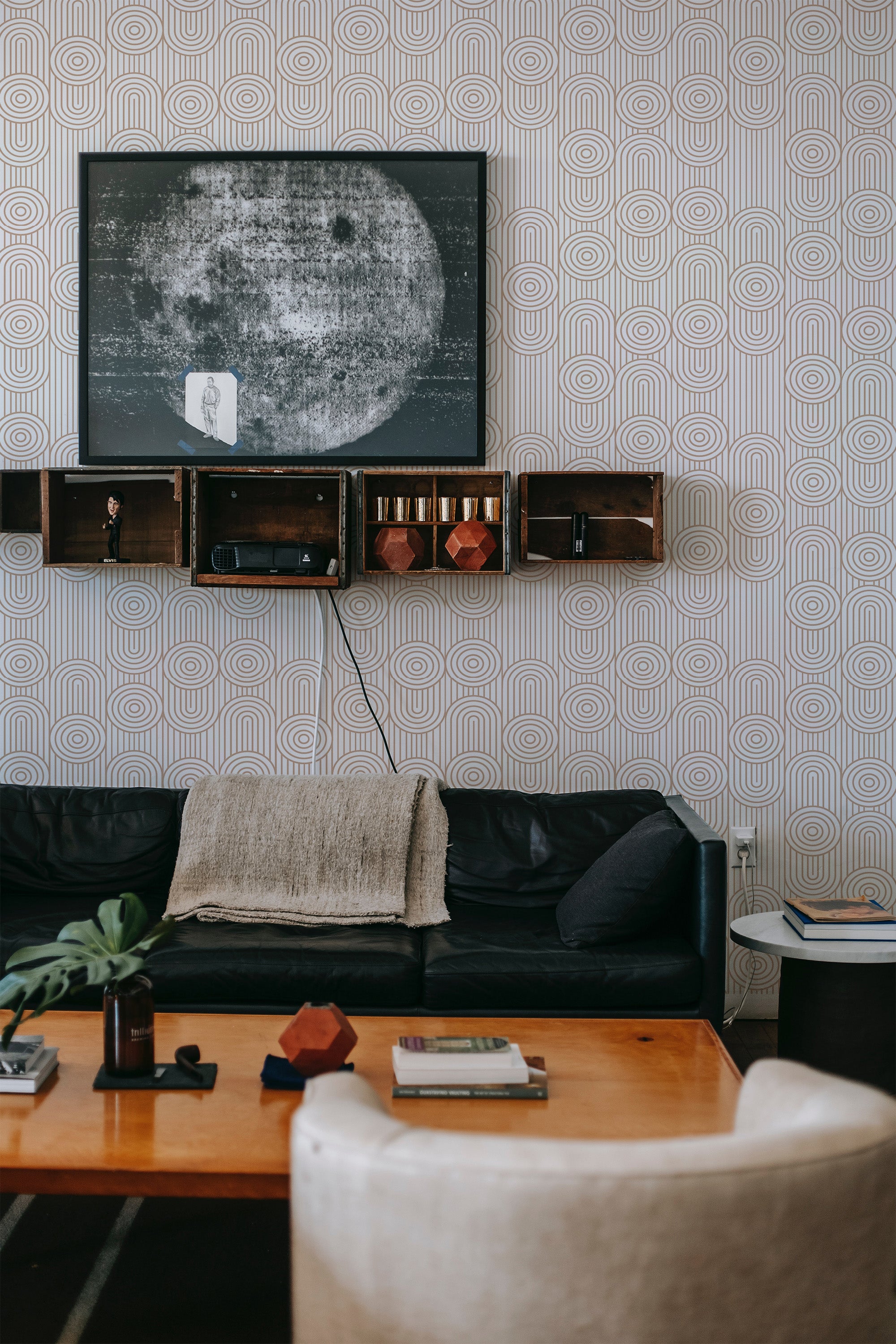 Wallpaper with a repeating pattern of line circles in a geometric design, providing a subtle and elegant backdrop for the room. Traditional wallpaper.