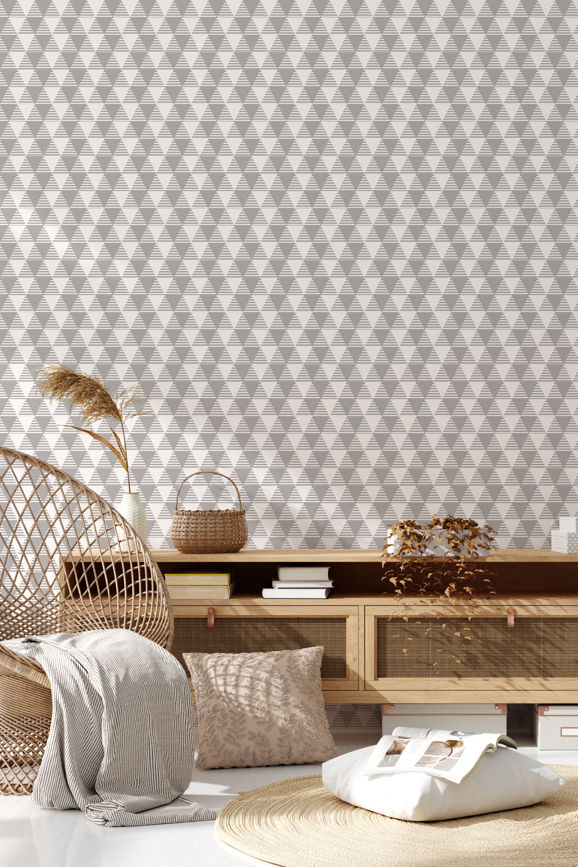 A room with seamless triangle pattern wallpaper, combining various shades of grey, creating a modern geometric aesthetic on the wall, complemented by contemporary decor, classified as traditional wallpaper.