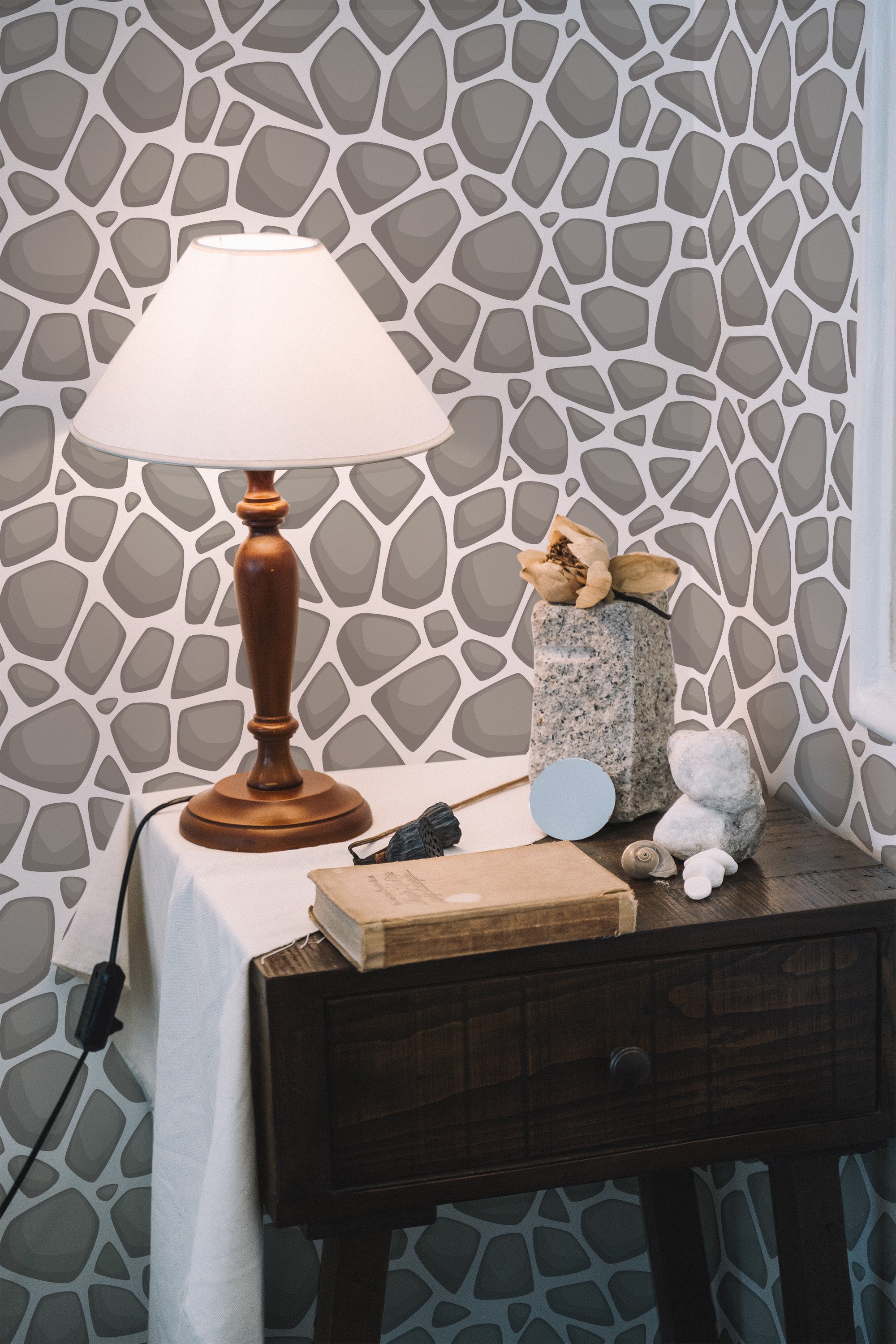 Self-adhesive wallpaper with a stone pattern in varying shades of gray, arranged in an irregular, organic design, mimicking natural stone formations.