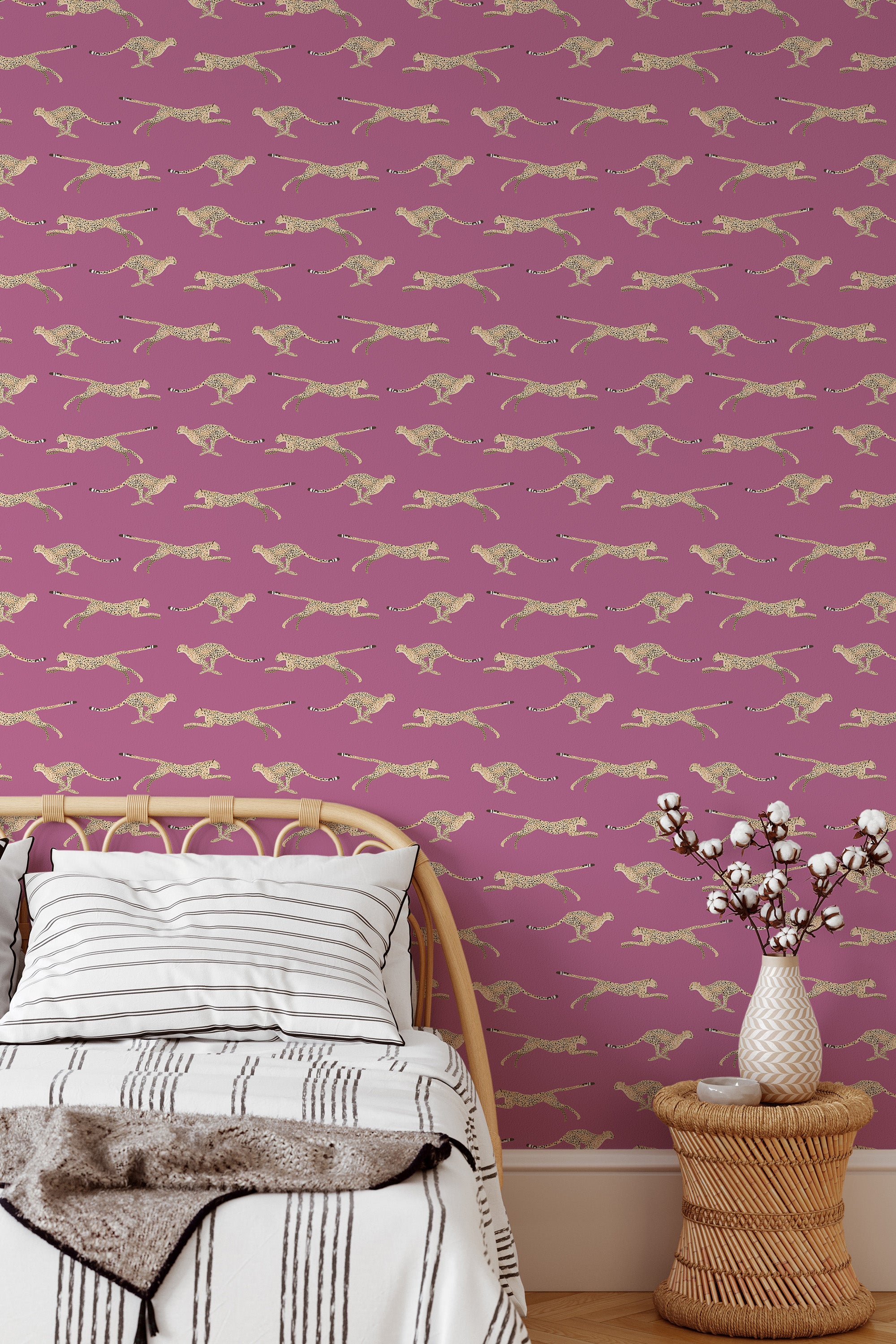 Self-adhesive wallpaper with a repeating cheetah pattern, set against a deep mauve background, adding a bold and wild touch to the room.
