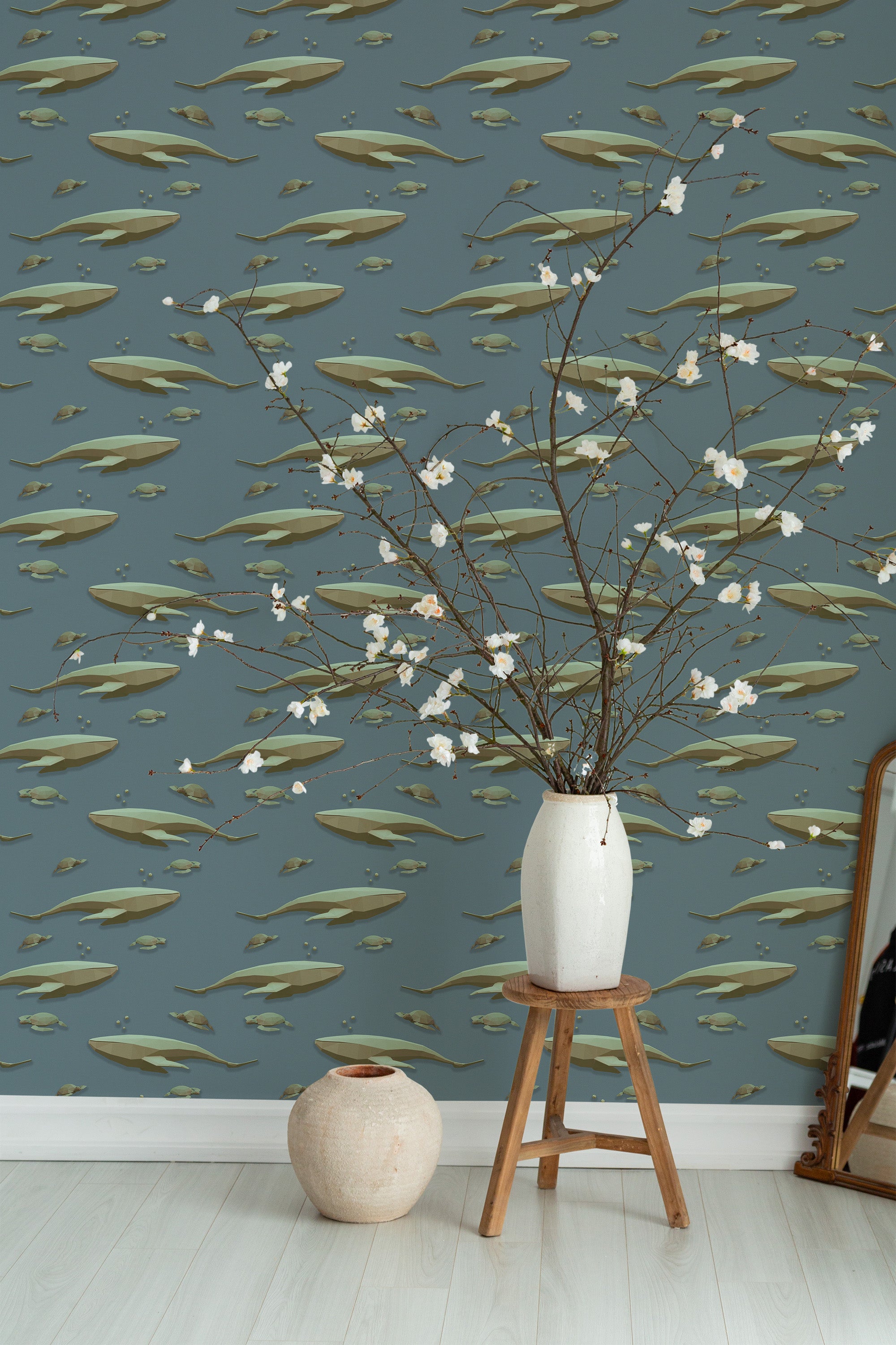 Self-adhesive wallpaper with a Blue Whale design, showing large, graceful whales swimming among smaller fish on a muted blue background.