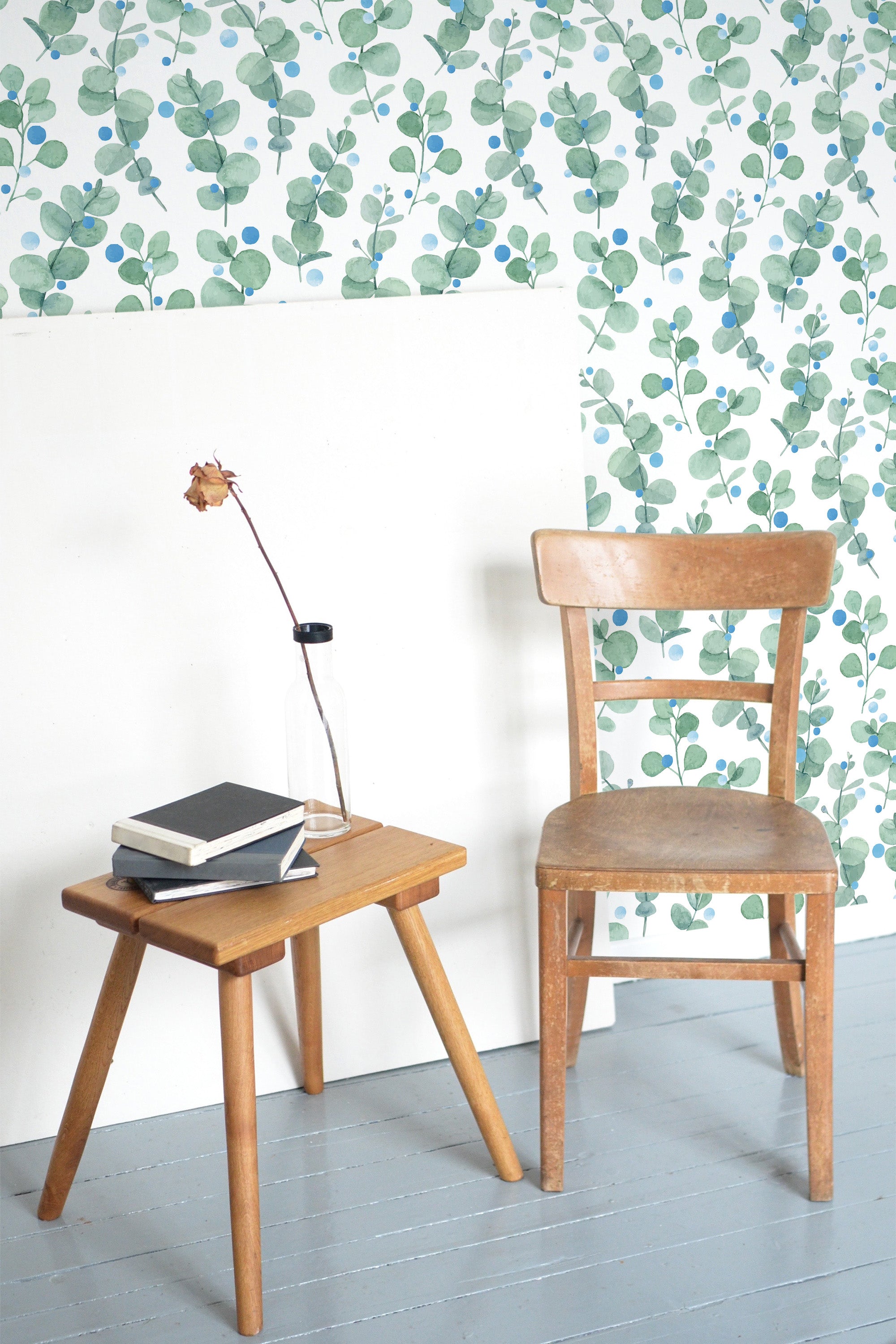 Self-adhesive eucalyptus-themed wallpaper with green and blue eucalyptus leaves scattered across a white background.