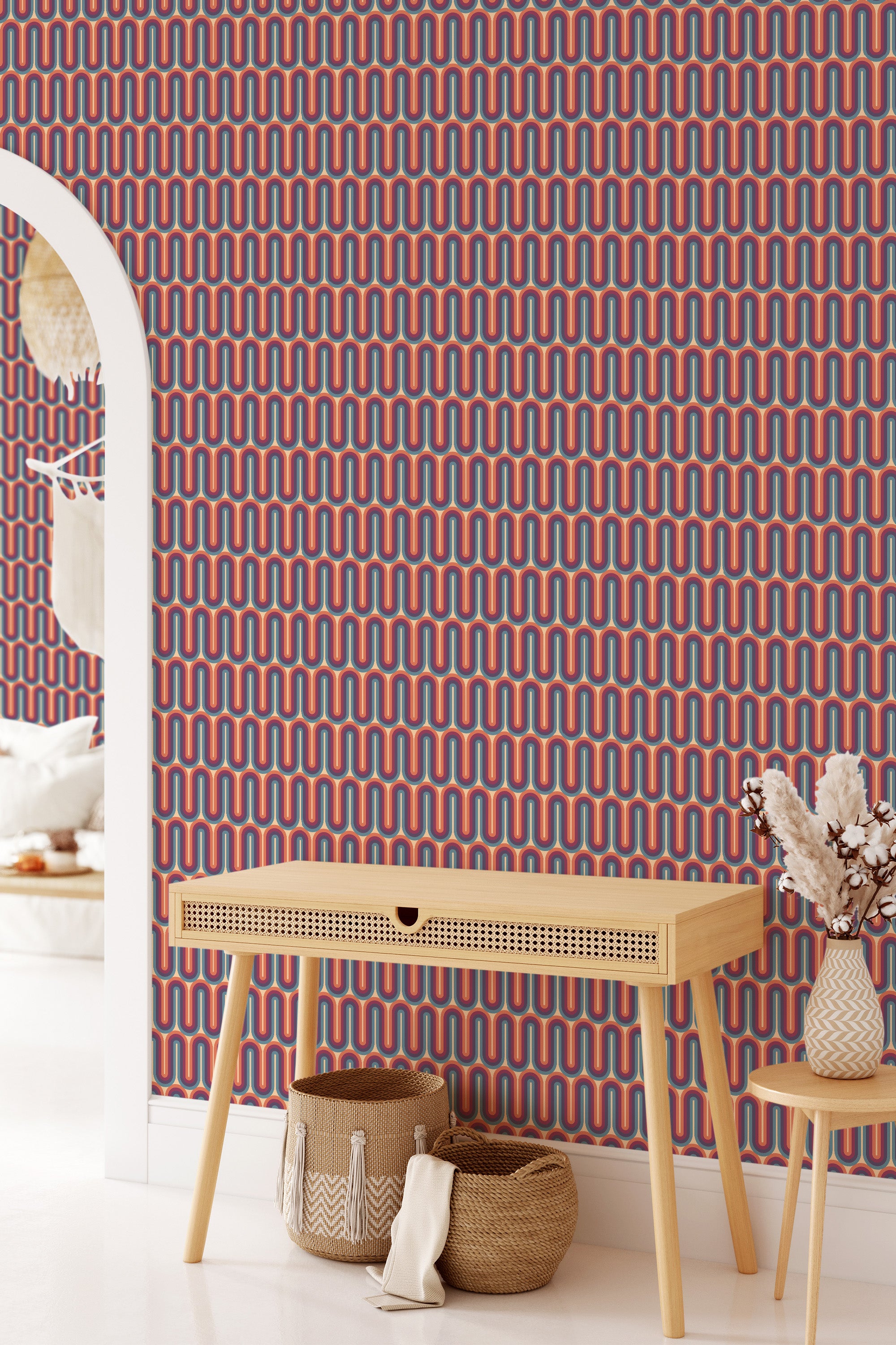 Purple retro wave wallpaper following a continuous undulating pattern of wavy lines in shades of purple, blue, and orange, creating a bold, visually dynamic backdrop. The room is styled in light wood furniture contrasting the vibrant wall design. Traditional wallpaper.