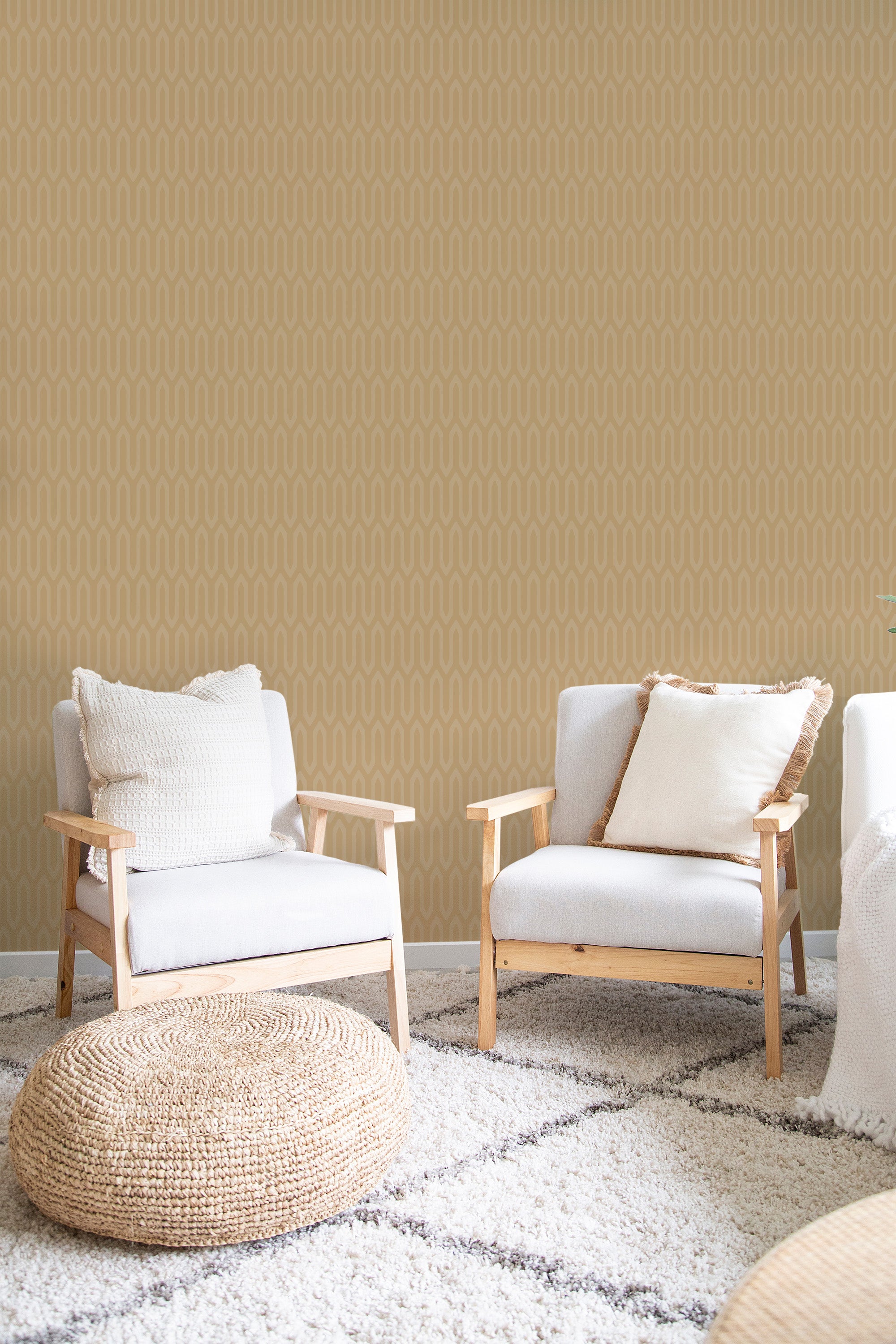 Retro wave-patterned wallpaper in vibrant yellow tones with repeating curved lines and soft geometric shapes, giving a mid-century modern feel to the room, complemented by light-colored furniture and natural textures. Traditional wallpaper.