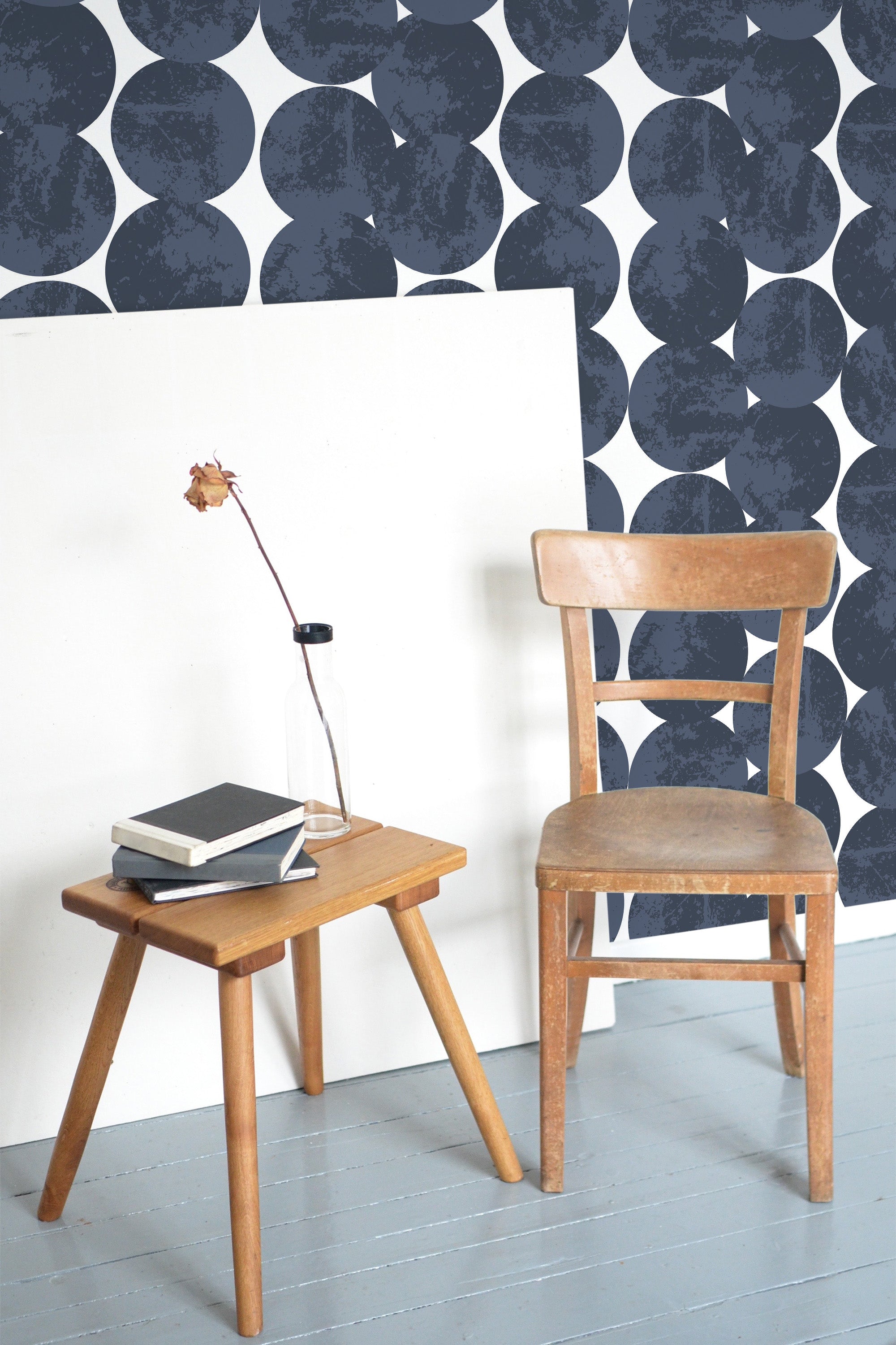 Self-adhesive wallpaper with a bold, large circular pattern in dark navy blue, arranged on a white background, creating a striking, contemporary geometric design.