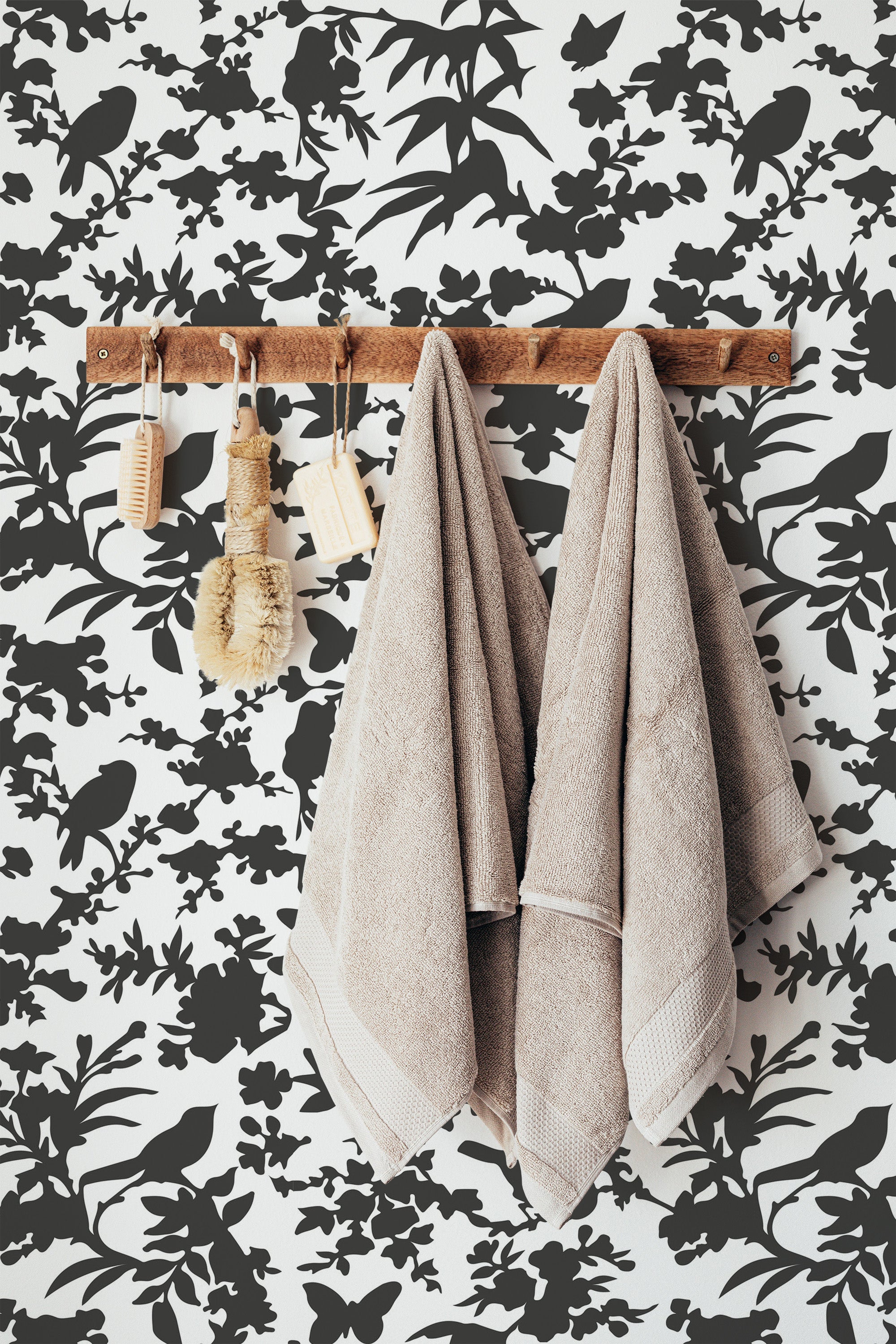 Self-adhesive wallpaper with a bird silhouette design in black on a white background, featuring birds perched among floral and leafy branches.