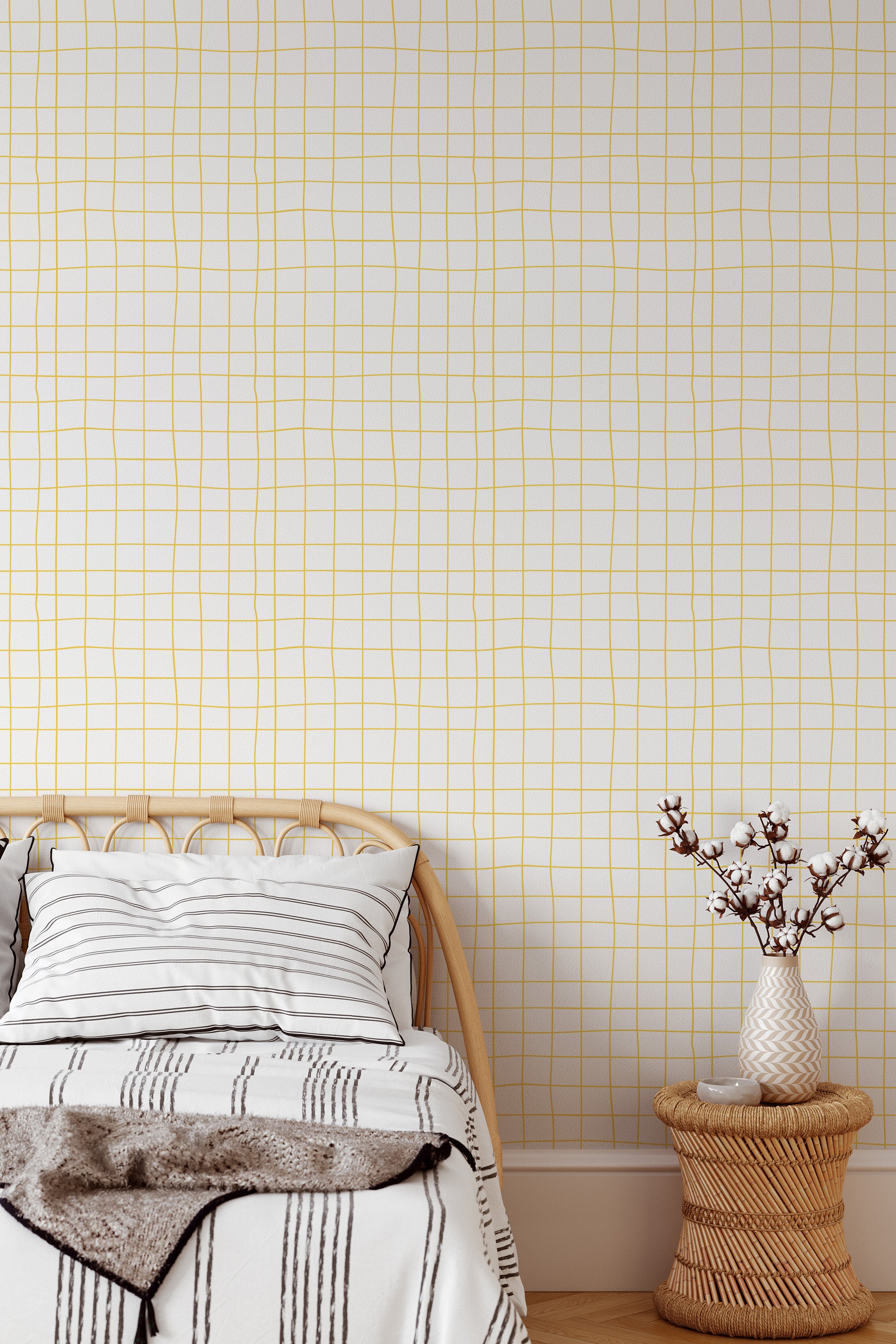 Self-adhesive wallpaper with a hand-drawn grid design in a soft yellow color on a light background, adding a minimalist and modern touch to the room's d��cor.