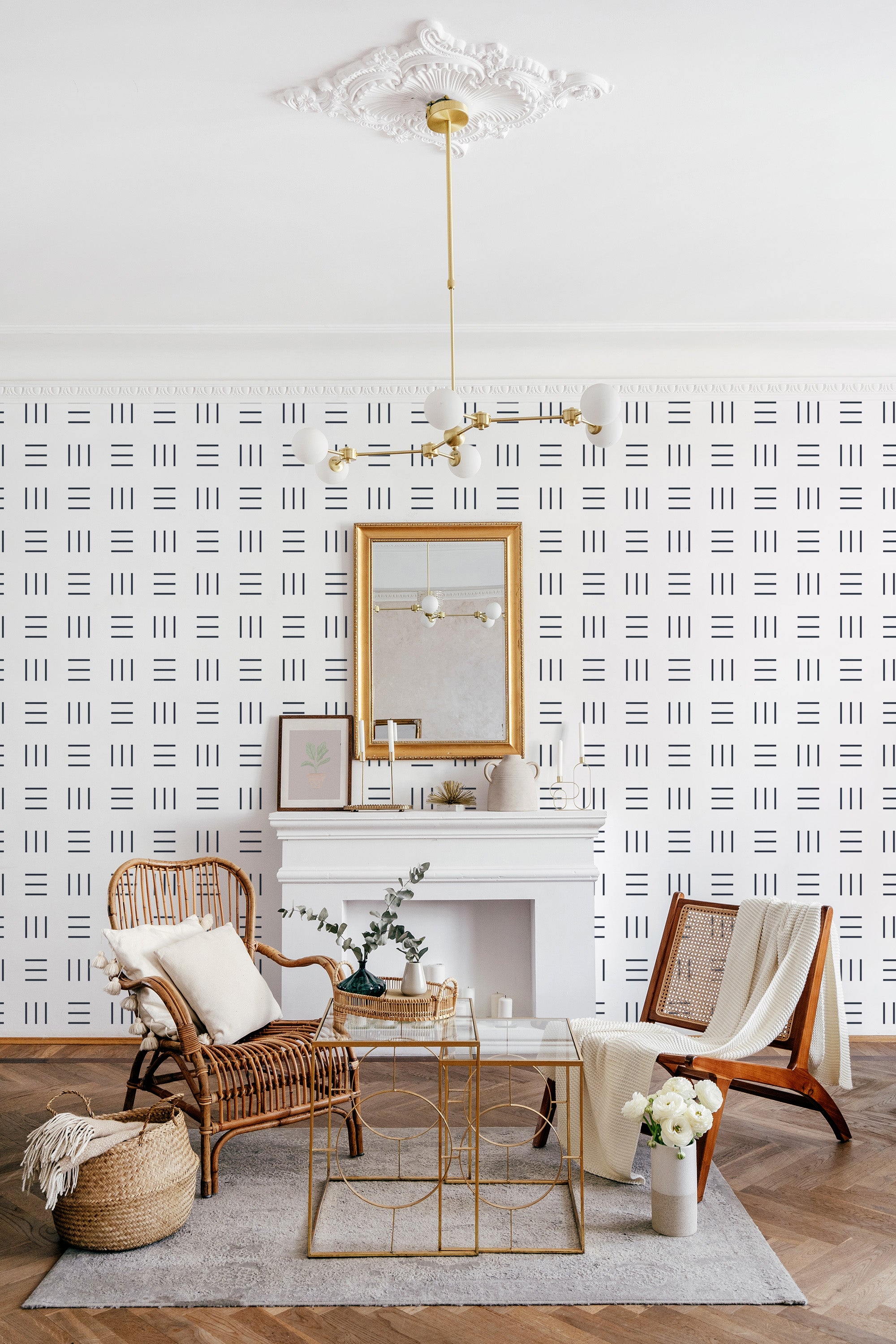White wall with a black geometric stroke pattern in a grid layout, paired with a gold chandelier and traditional furniture. Traditional wallpaper.