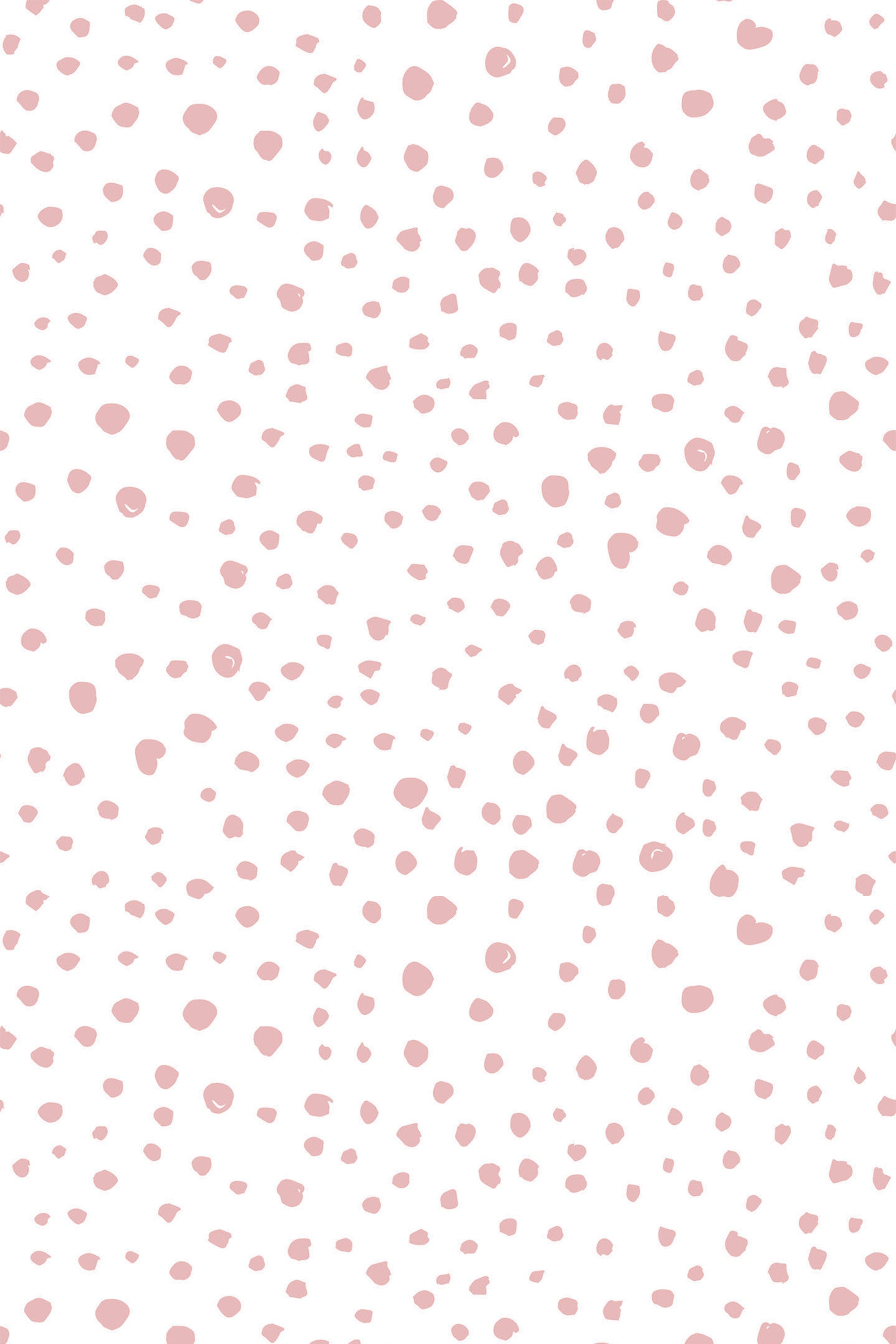 Pink dots of varying sizes scattered randomly across a white background, creating a soft and playful pattern. Peel and stick removable wallpaper.