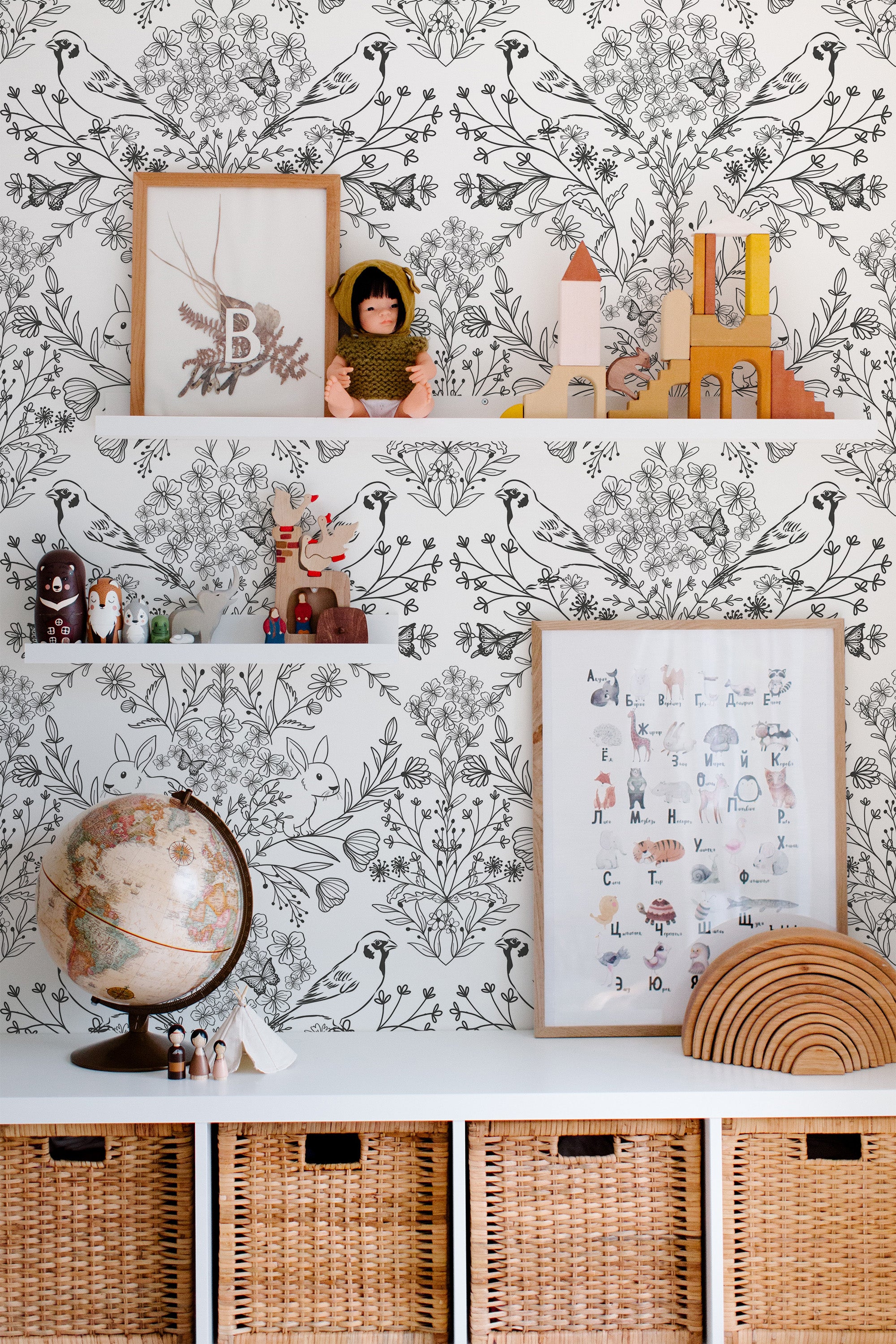 Self-adhesive wallpaper with a delicate bird and floral design in monochrome, creating an intricate and nature-inspired pattern that adds a serene and elegant touch to the room.