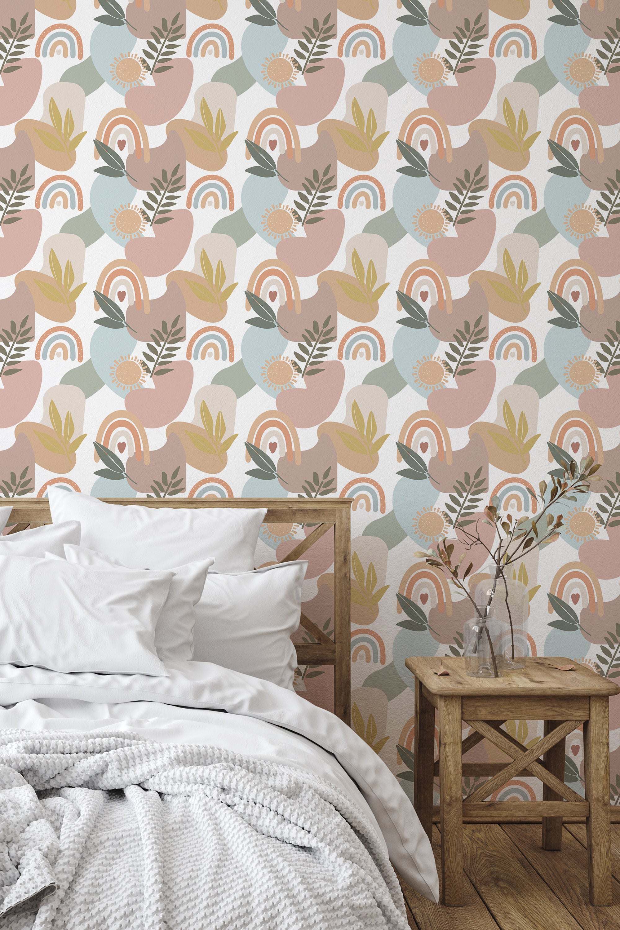 Self-adhesive wallpaper with a large boho design of abstract shapes, leaves, arching rainbows, and sun motifs in soft pastel tones of pink, blue, green, and yellow.