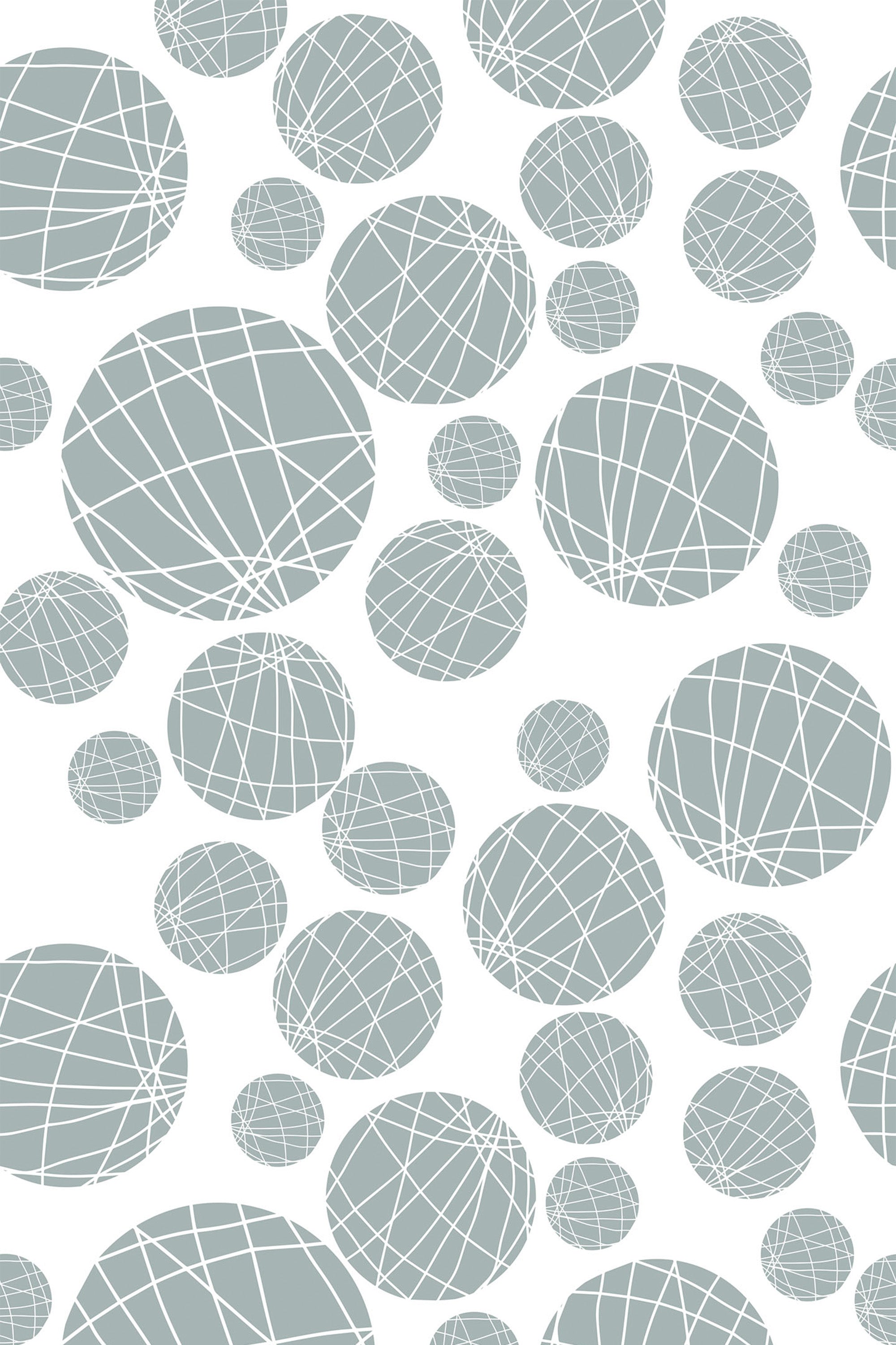 Abstract pattern of overlapping pale green circles filled with white crisscrossing lines on a white background. Peel and stick removable wallpaper.