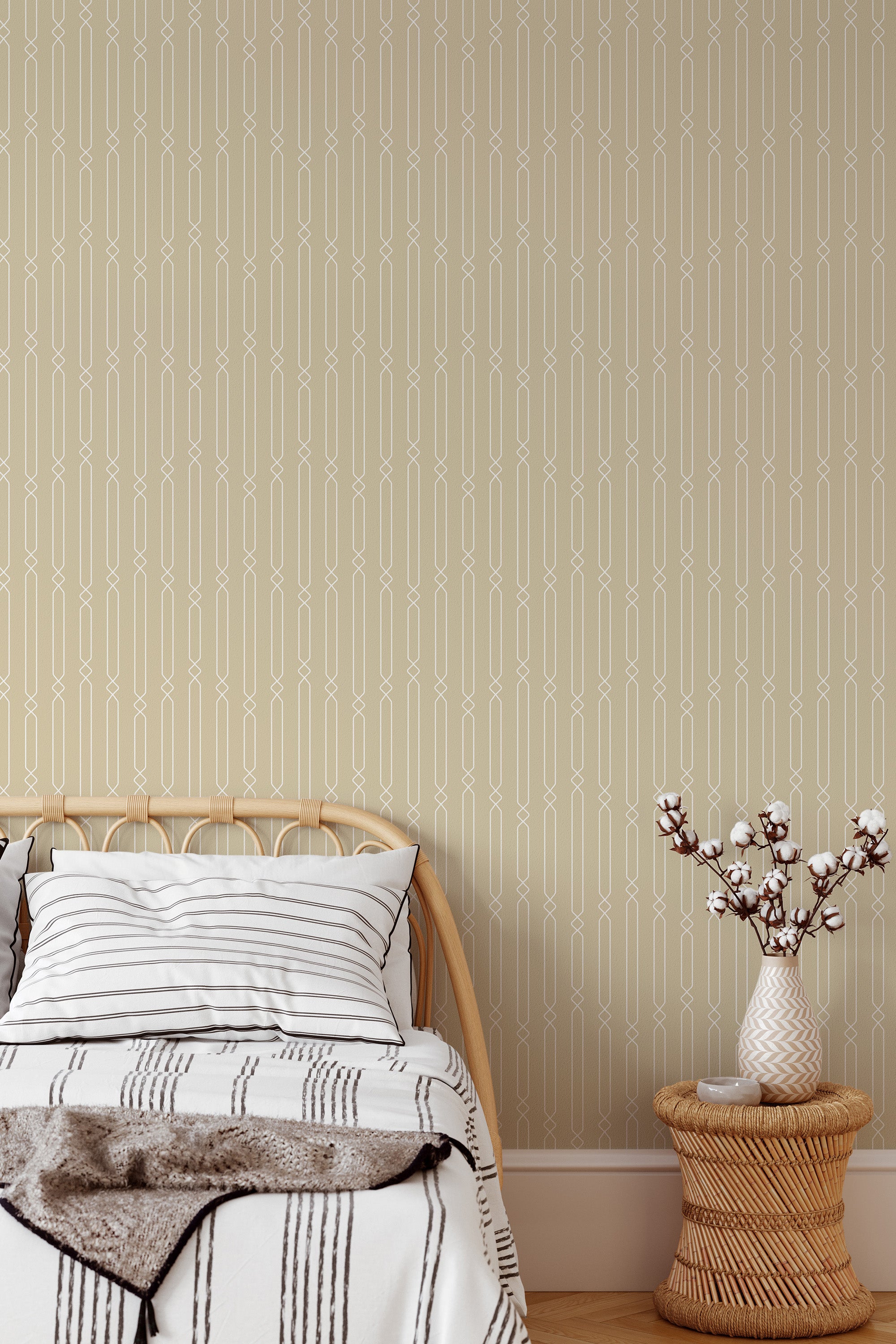 Self-adhesive wallpaper with a geometric luxury design in beige and white, creating an elegant and sophisticated vertical pattern on the wall behind a cozy bed setup with neutral bedding and a small side table holding a minimalist vase.