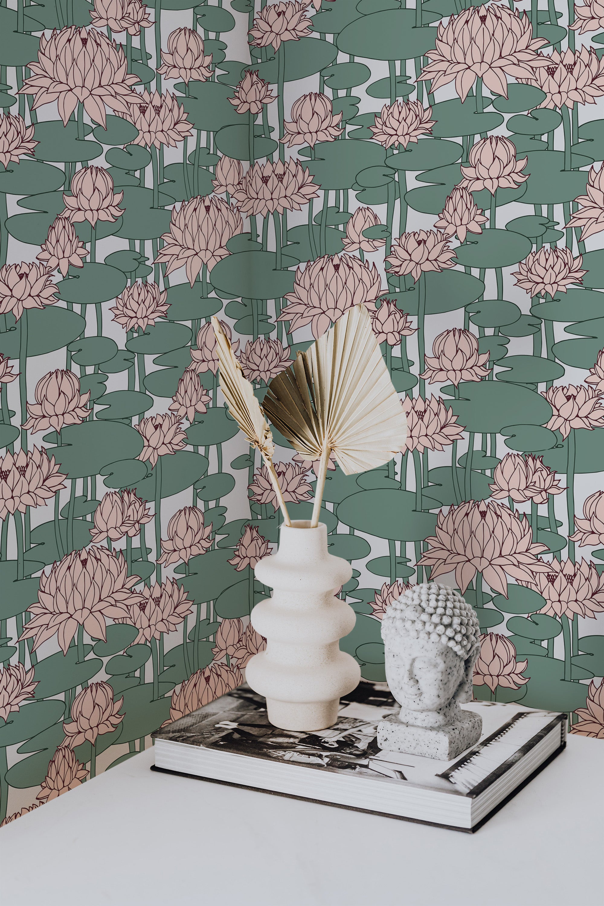 Self-adhesive wallpaper with a lotus design in soft pinks and greens, featuring large stylized lotus flowers and lily pads arranged across the wall, creating a serene, nature-inspired atmosphere.