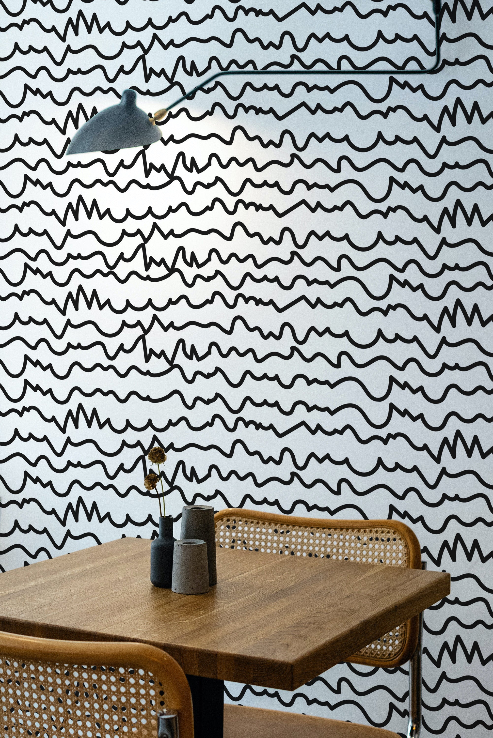 Self-adhesive wallpaper with a modern abstract line art design, showcasing irregular black wavy lines on a white background. The minimalistic and contemporary style adds visual texture to the room.