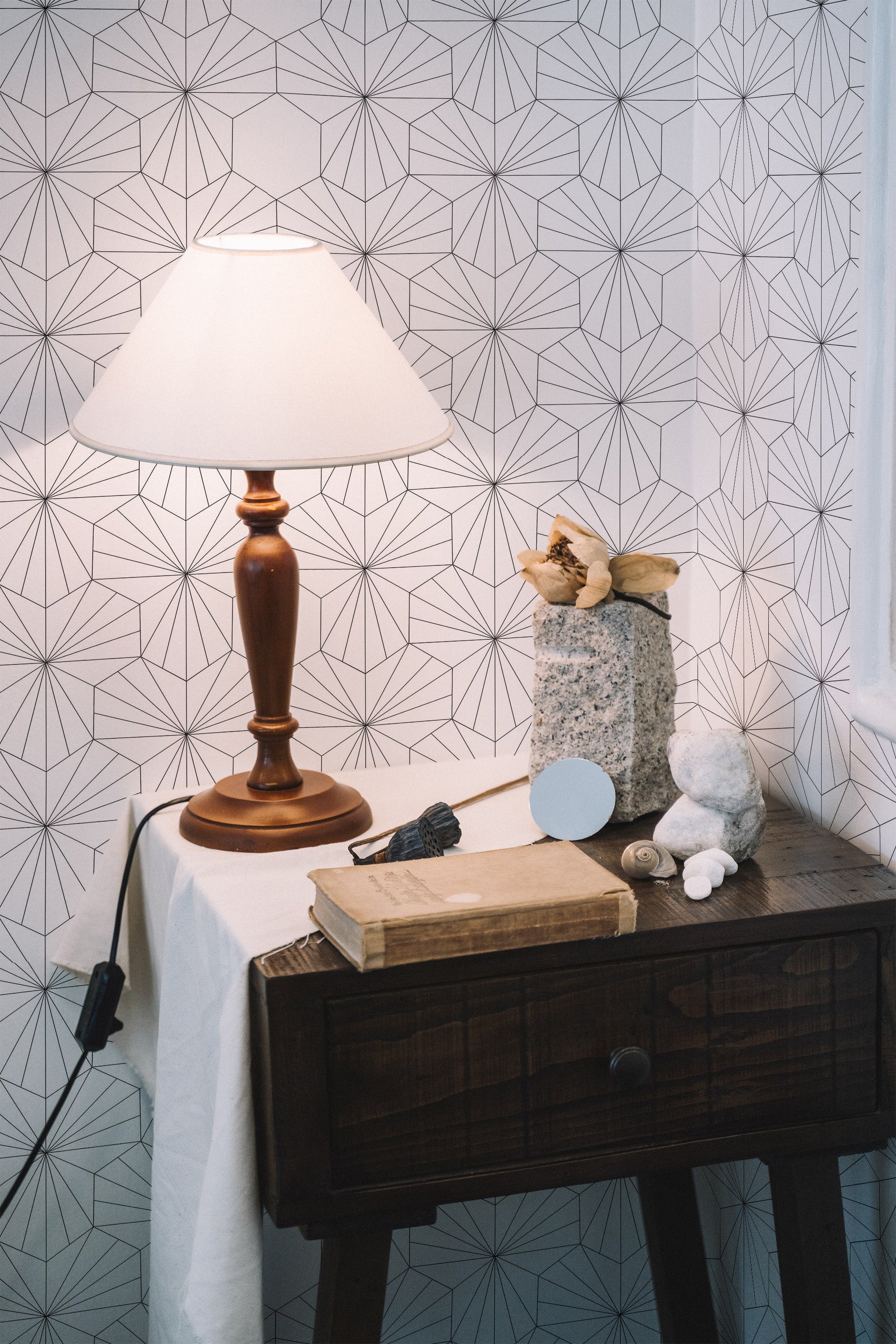 Self-adhesive wallpaper with an abstract geometric print, featuring thin, interlocking lines forming intricate polygonal shapes, creating a modern, minimalist look.