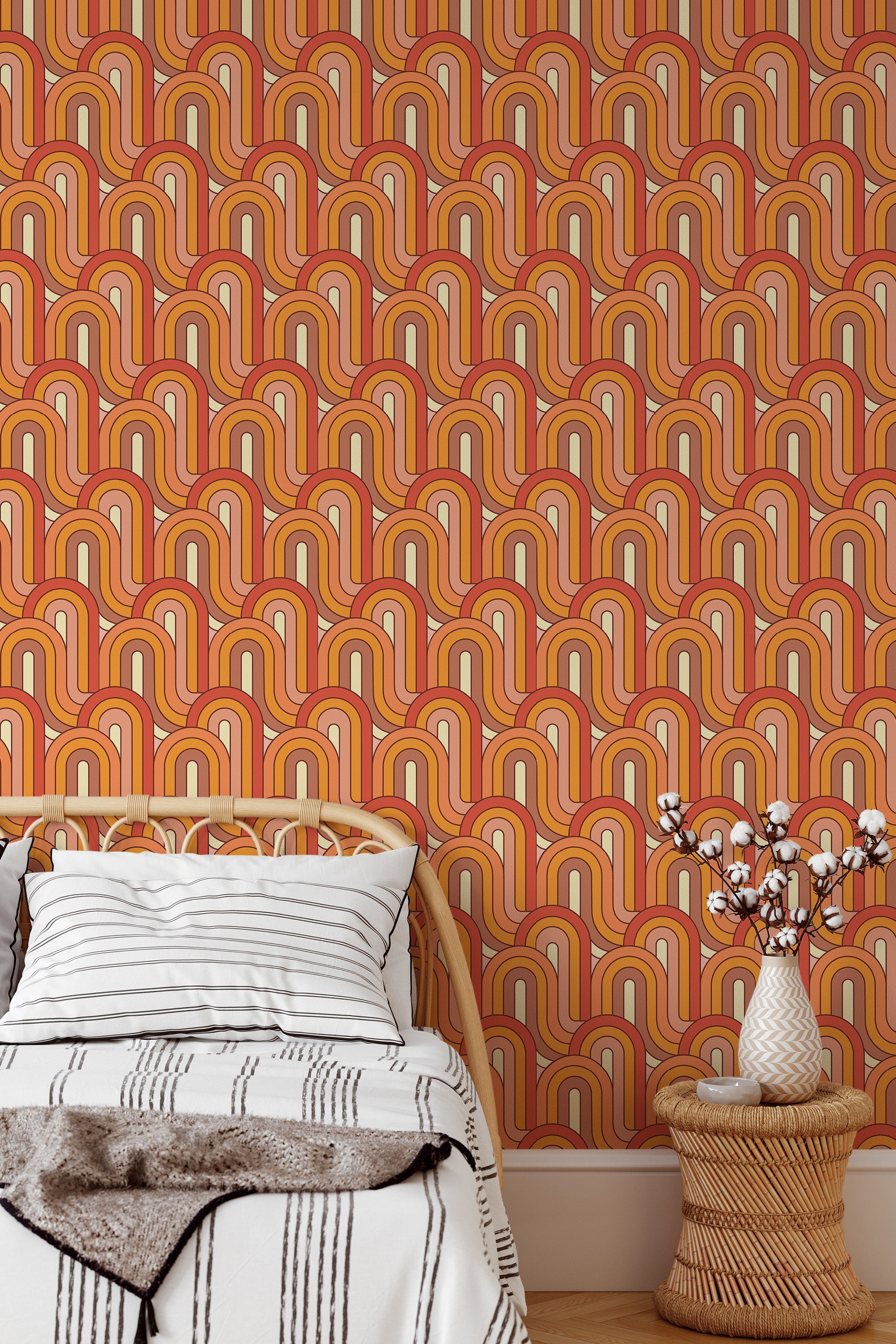 Self-adhesive Retro wave wallpaper in vibrant warm tones, including orange, red, and cream hues, arranged in an arch pattern reminiscent of the 1970s, creating a bold vintage aesthetic in the room.