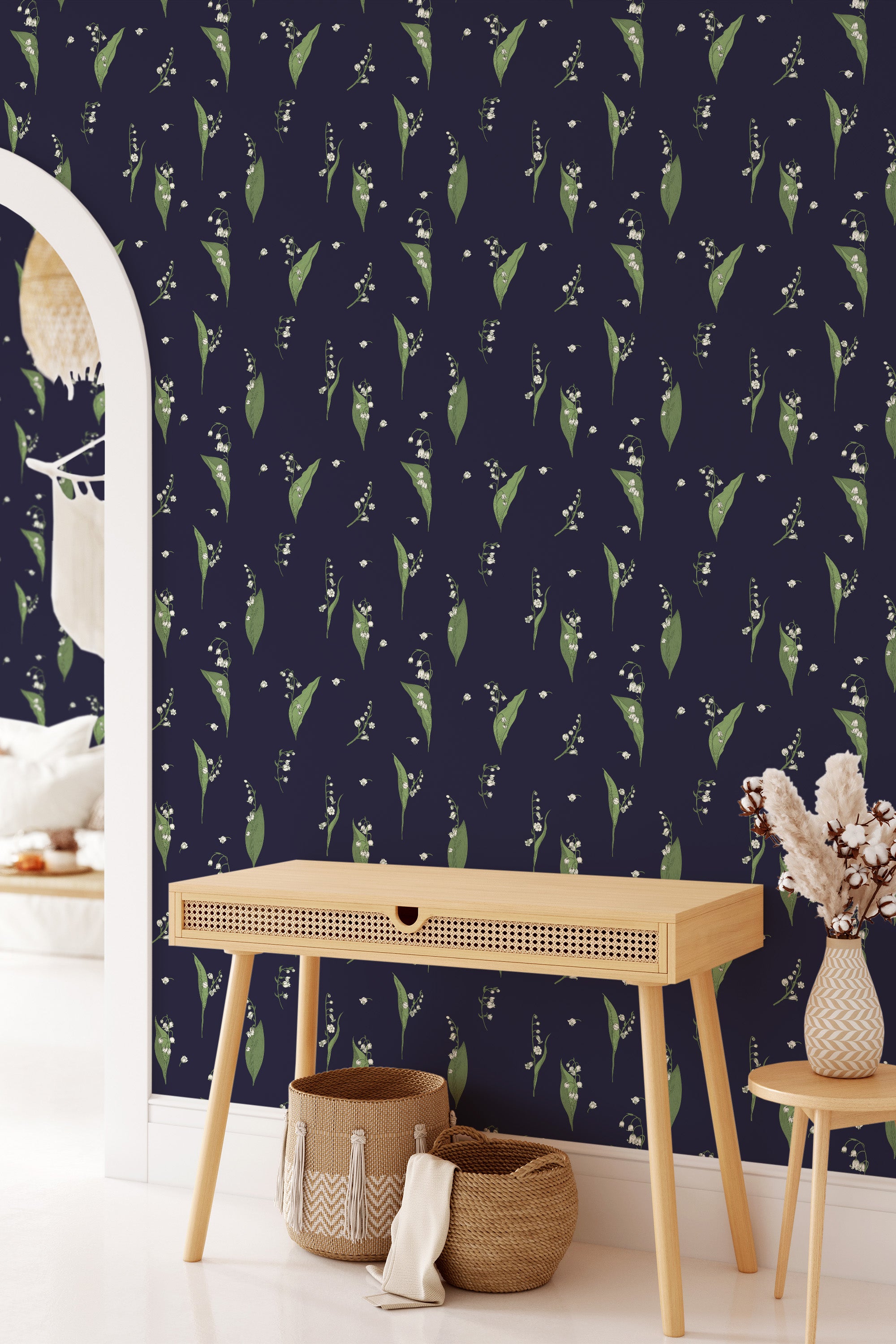 A room with navy blue wallpaper adorned with green leaves and white snowdrops, creating a natural, elegant pattern. Traditional wallpaper.