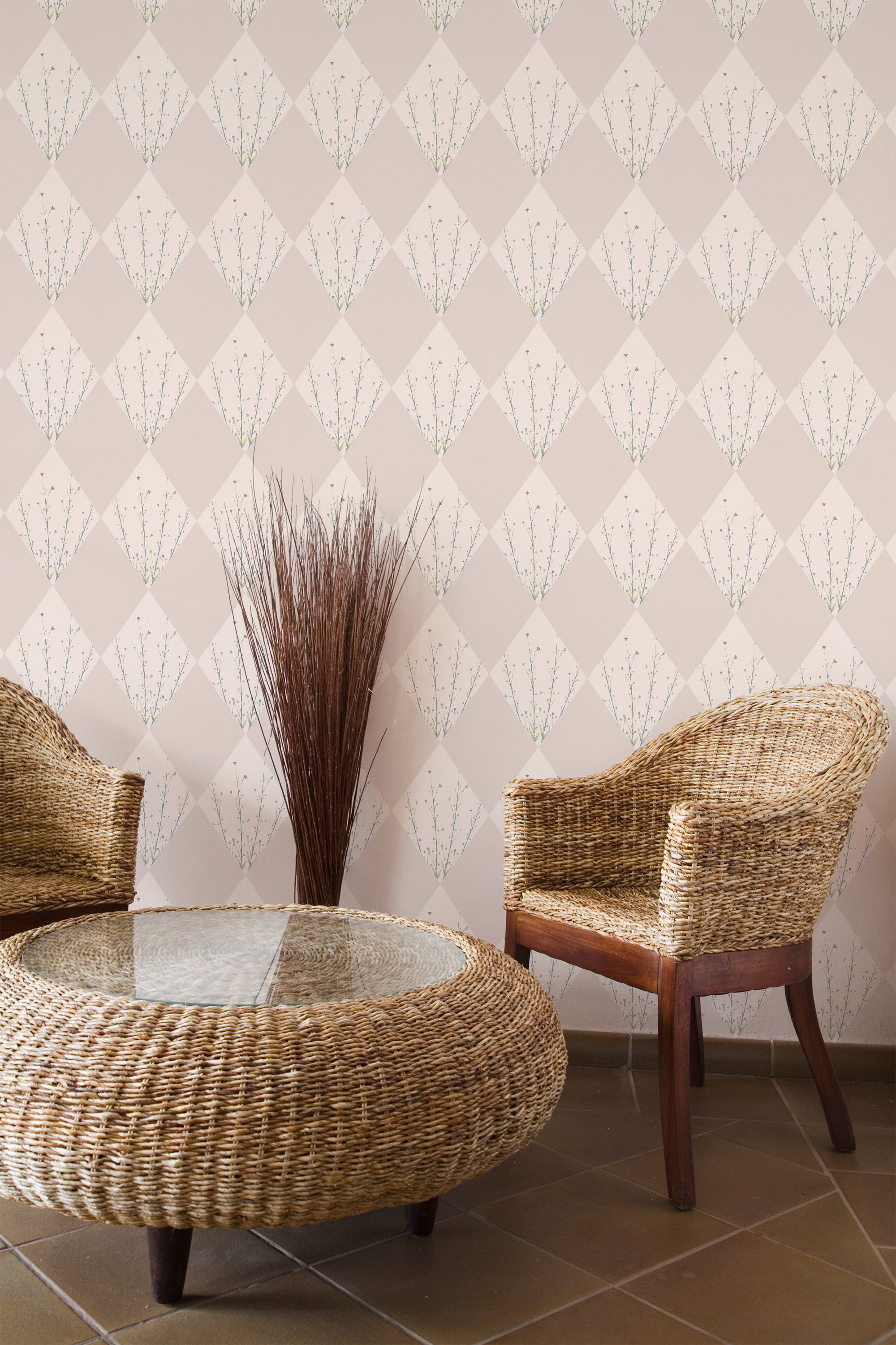 Self-adhesive wallpaper with a neutral floral diamond pattern on a beige background in a room with wicker furniture.